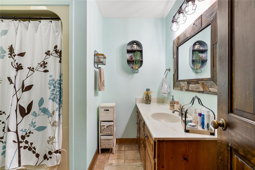 801 Princeton Highway Honea Path, SC 29654 - Photo 22 of 49 This bright bathroom features a spacious vanity with ample storage and a charming shower area.