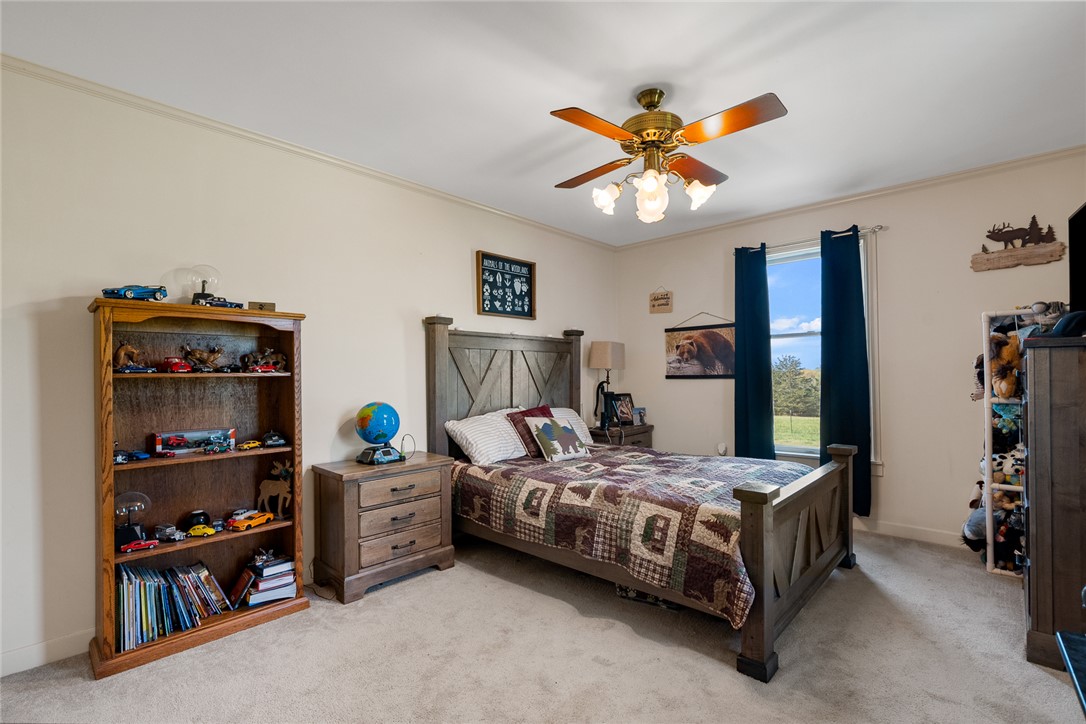 801 Princeton Highway Honea Path, SC 29654 - Photo 24 of 49 This cozy bedroom offers a tranquil retreat with a ceiling fan and ample natural light.