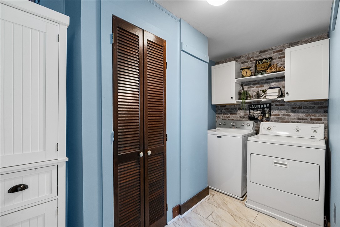 801 Princeton Highway Honea Path, SC 29654 - Photo 25 of 49 This functional laundry room features modern appliances and elegant louvered doors, ensuring effortless chores.