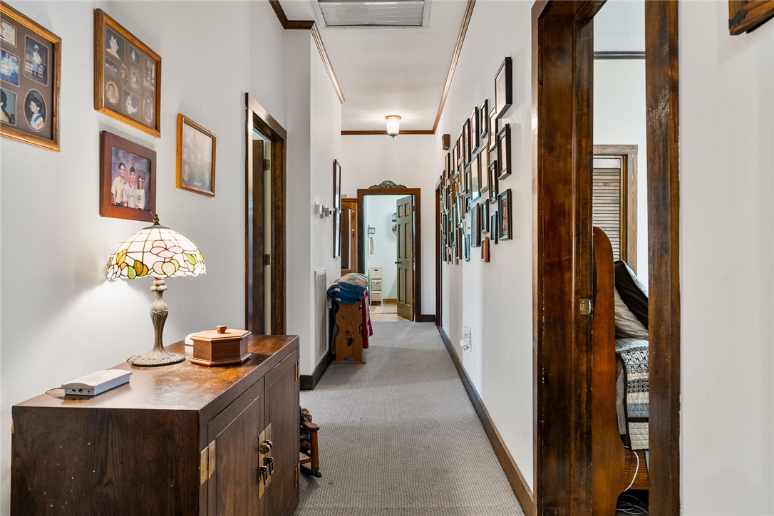 801 Princeton Highway Honea Path, SC 29654 - Photo 3 of 49 This inviting hallway features classic design elements, creating a warm and welcoming atmosphere.