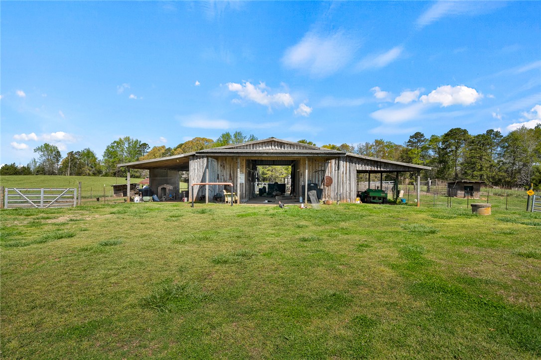 801 Princeton Highway Honea Path, SC 29654 - Photo 34 of 49 This spacious barn offers ample covered storage and functional open-air stalls, perfect for agricultural pursuits.