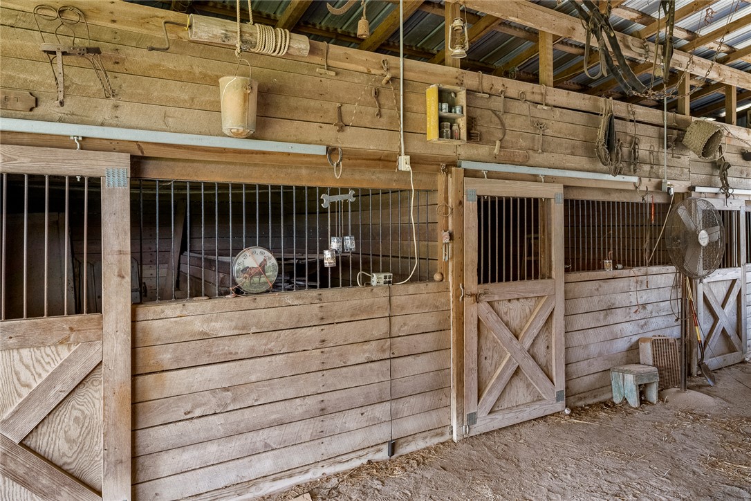 801 Princeton Highway Honea Path, SC 29654 - Photo 36 of 49 This rustic stable offers functional stalls, providing a charming equestrian space.