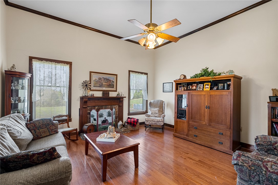801 Princeton Highway Honea Path, SC 29654 - Photo 4 of 49 This inviting living room offers warm hardwood floors and a charming fireplace, perfect for cozy gatherings.