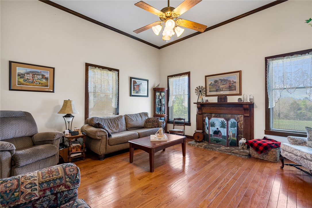 801 Princeton Highway Honea Path, SC 29654 - Photo 5 of 49 This inviting living room features gleaming hardwood floors and a cozy fireplace.