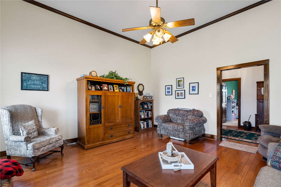 801 Princeton Highway Honea Path, SC 29654 - Photo 6 of 49 This airy living area features rich hardwood flooring and a vaulted ceiling, creating an inviting space.