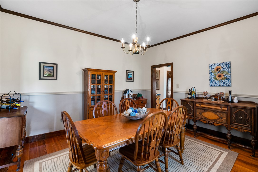 801 Princeton Highway Honea Path, SC 29654 - Photo 9 of 49 This inviting dining area features warm wood flooring and classic architectural details, perfect for memorable gatherings.