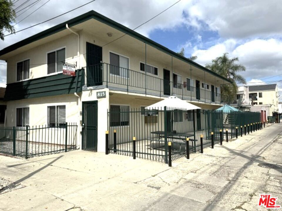 815 East 9th Street Long Beach, CA 90813 - Photo 4 of 5 a front view of a house with a patio