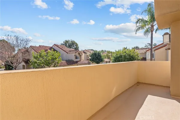 a view of balcony with wooden floor and city view