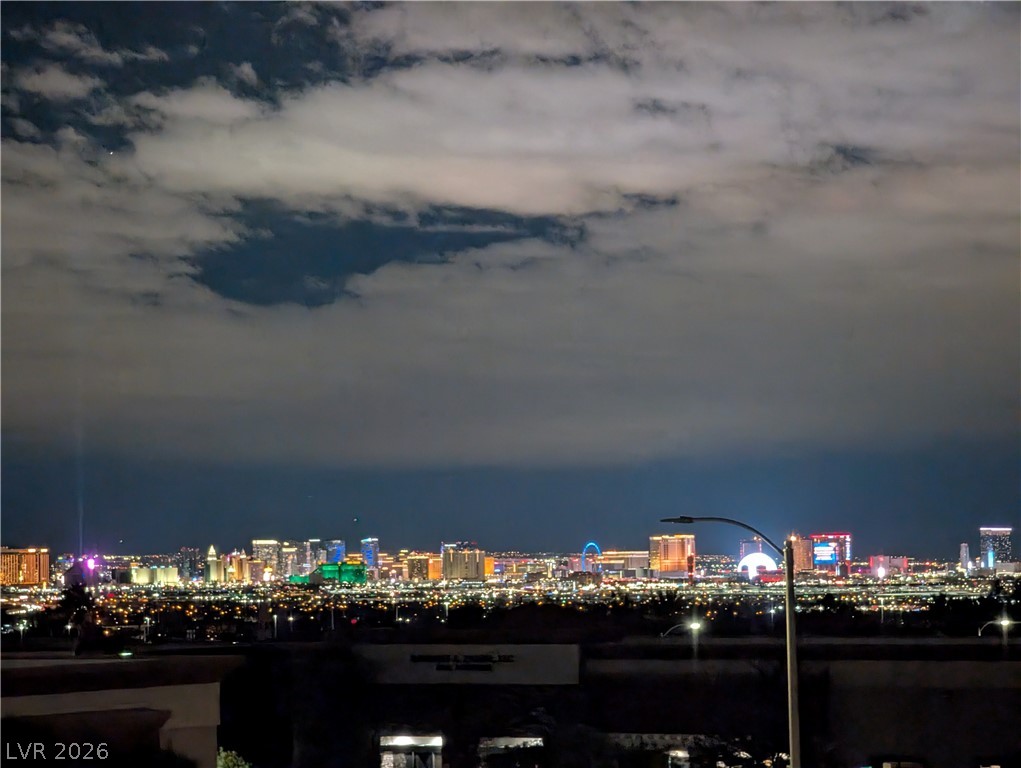2305 West Horizon Ridge Parkway, Unit 224 Henderson, NV 89052 - Photo 1 of 41 City lights illuminate the night sky with a captivating urban panorama.