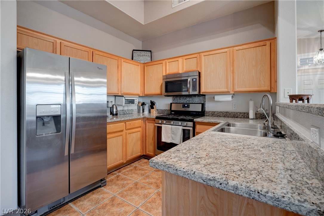 2305 West Horizon Ridge Parkway, Unit 224 Henderson, NV 89052 - Photo 14 of 41 This inviting kitchen features ample counter space, rich cabinetry, and modern appliances for daily living.