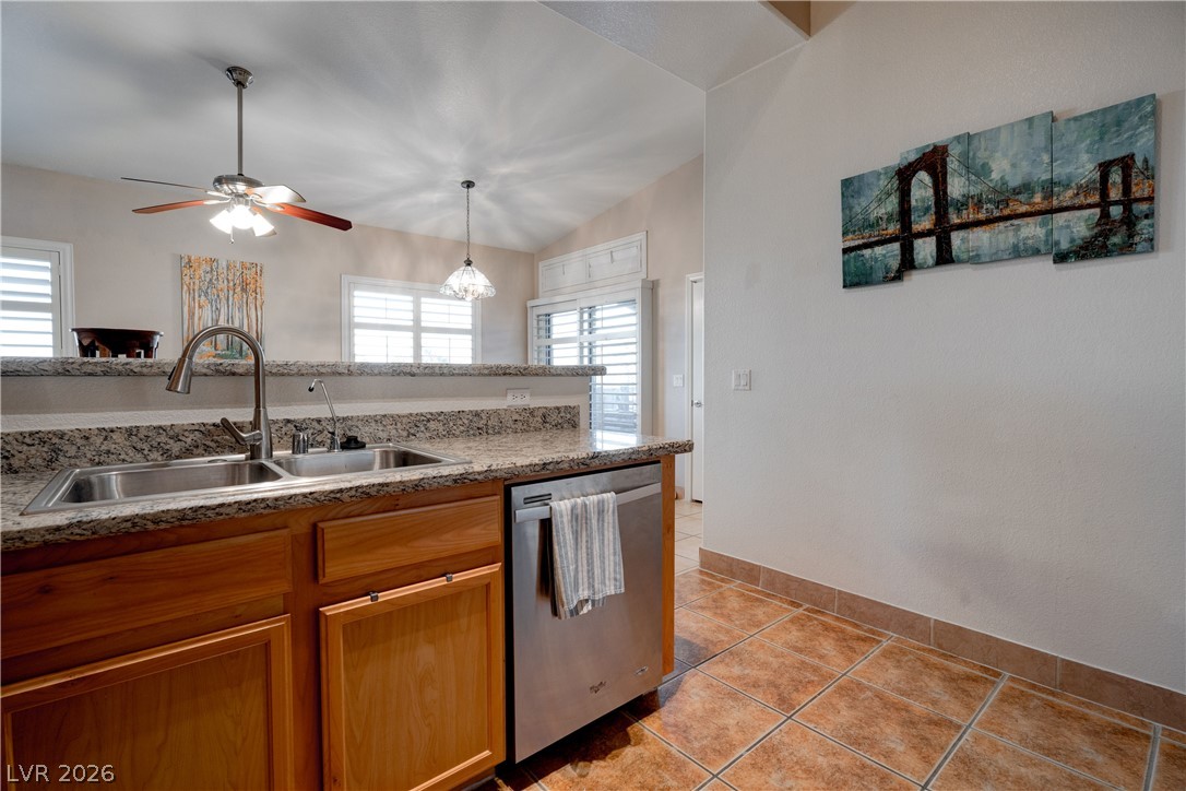 2305 West Horizon Ridge Parkway, Unit 224 Henderson, NV 89052 - Photo 17 of 41 This bright kitchen features a double sink and ample counter space, perfect for daily living.