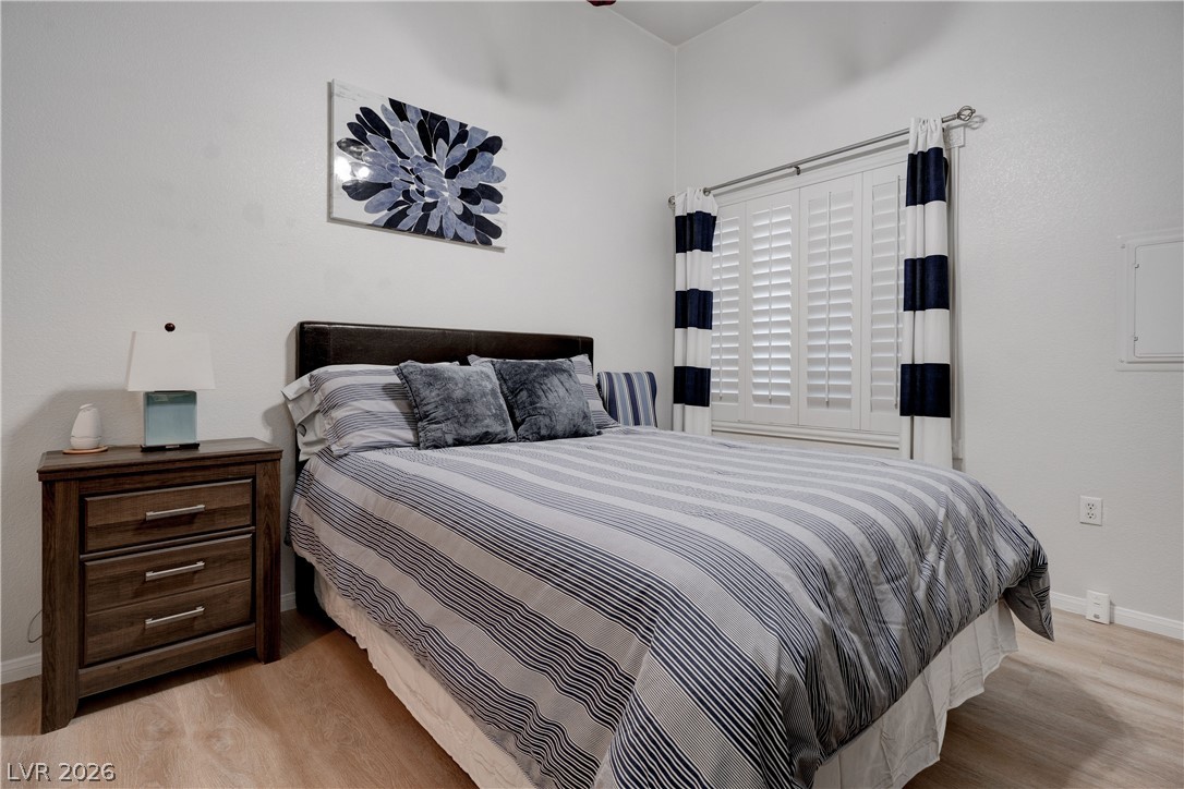 2305 West Horizon Ridge Parkway, Unit 224 Henderson, NV 89052 - Photo 24 of 41 This inviting bedroom features natural light and durable flooring, creating a comfortable and practical living space.