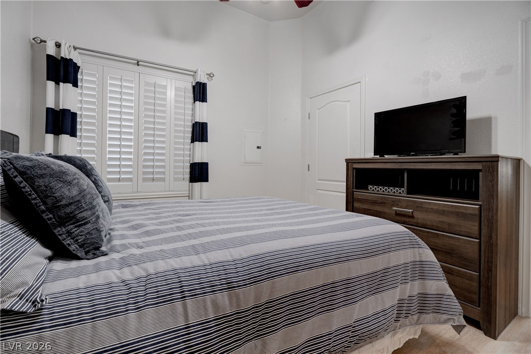 2305 West Horizon Ridge Parkway, Unit 224 Henderson, NV 89052 - Photo 25 of 41 This cozy bedroom features bright white walls and a large window with privacy shutters.