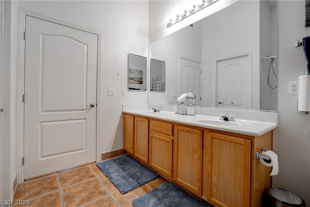 2305 West Horizon Ridge Parkway, Unit 224 Henderson, NV 89052 - Photo 27 of 41 This bathroom features dual sinks and tile flooring for comfortable daily routines.