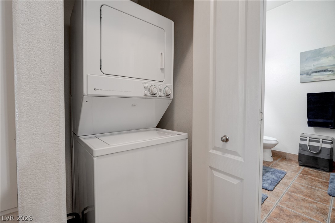 2305 West Horizon Ridge Parkway, Unit 224 Henderson, NV 89052 - Photo 29 of 41 This convenient laundry space features a stacked washer and dryer, adjacent to a neatly tiled bathroom.