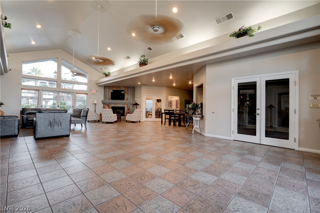 2305 West Horizon Ridge Parkway, Unit 224 Henderson, NV 89052 - Photo 36 of 41 An inviting gathering space features an elegant fireplace, ample natural light, and classic tile flooring.
