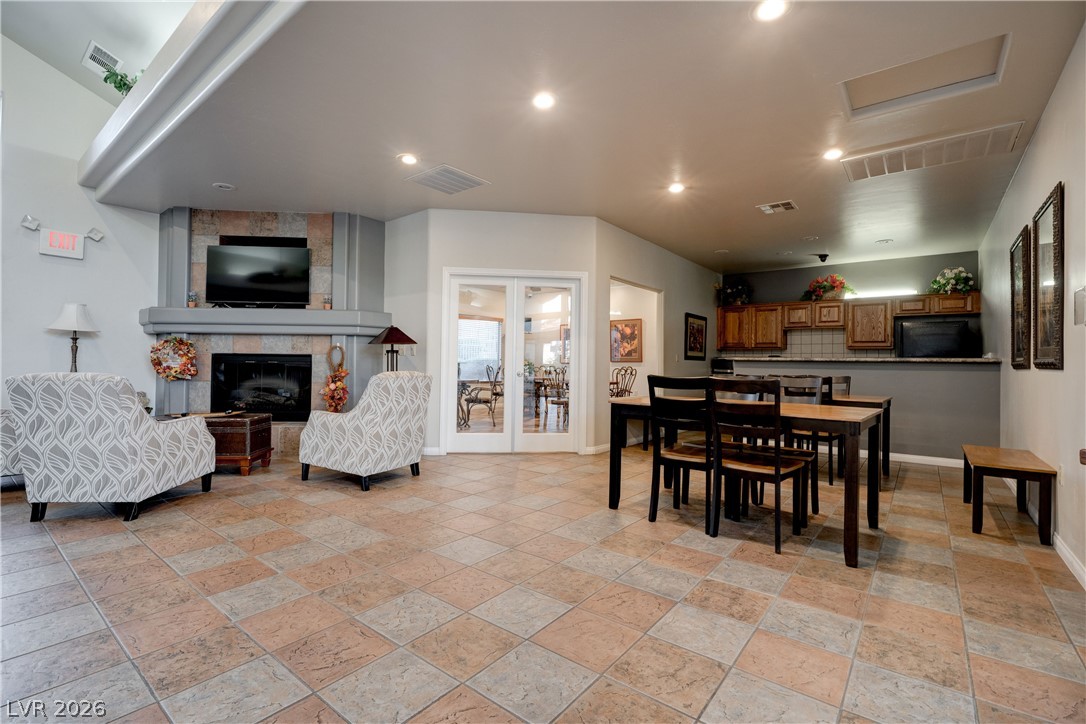2305 West Horizon Ridge Parkway, Unit 224 Henderson, NV 89052 - Photo 37 of 41 This communal space features a fireplace and offers a versatile area for dining and relaxation.