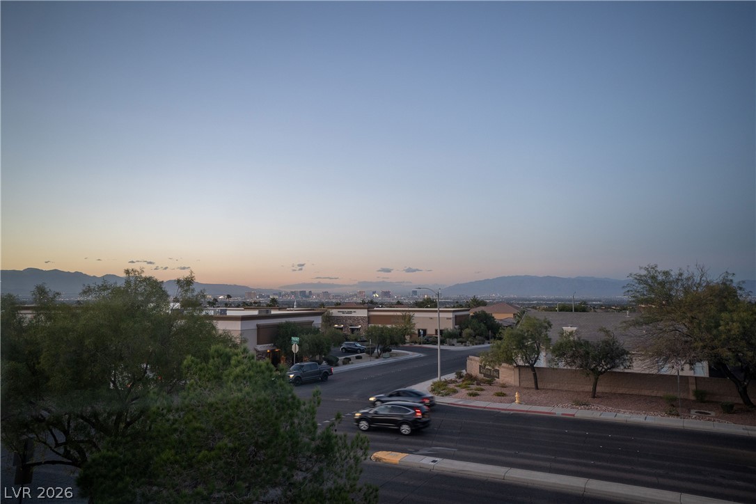 2305 West Horizon Ridge Parkway, Unit 224 Henderson, NV 89052 - Photo 4 of 41 This elevated view captures the cityscape and distant mountains under a twilight sky.