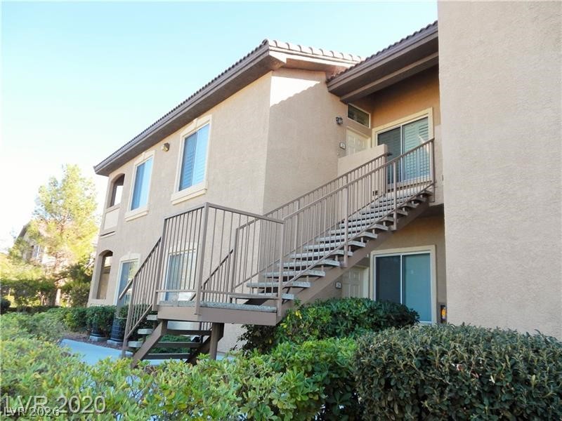 2305 West Horizon Ridge Parkway, Unit 224 Henderson, NV 89052 - Photo 6 of 41 This multi-story dwelling features accessible outdoor stairways, blending functionality with a clean aesthetic.