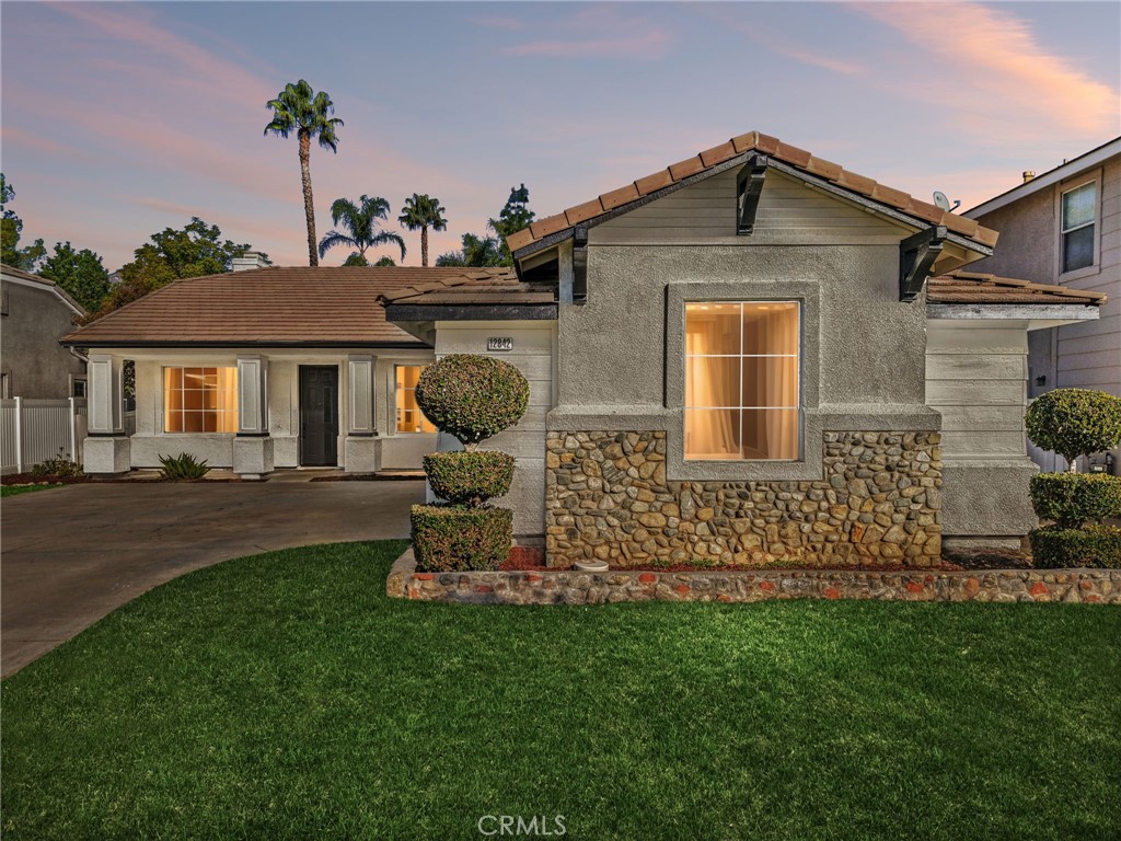 12842 Tilden Drive Rancho Cucamonga, CA 91739 - Photo 1 of 71 a front view of a house with garden