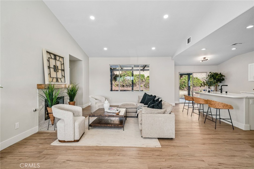 12842 Tilden Drive Rancho Cucamonga, CA 91739 - Photo 12 of 71 a living room with furniture and a wooden floor