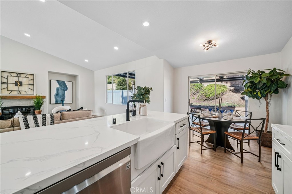 12842 Tilden Drive Rancho Cucamonga, CA 91739 - Photo 16 of 71 a living room with furniture a potted plant and open kitchen view