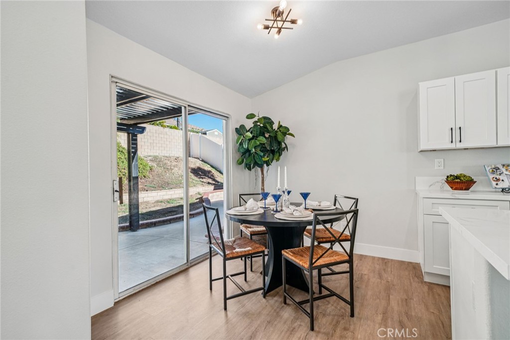 12842 Tilden Drive Rancho Cucamonga, CA 91739 - Photo 20 of 71 a view of a dining room with furniture and a potted plant
