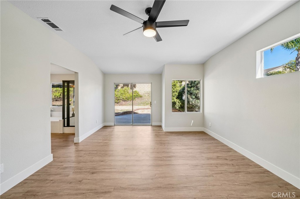 12842 Tilden Drive Rancho Cucamonga, CA 91739 - Photo 25 of 71 wooden floor in an empty room with a window