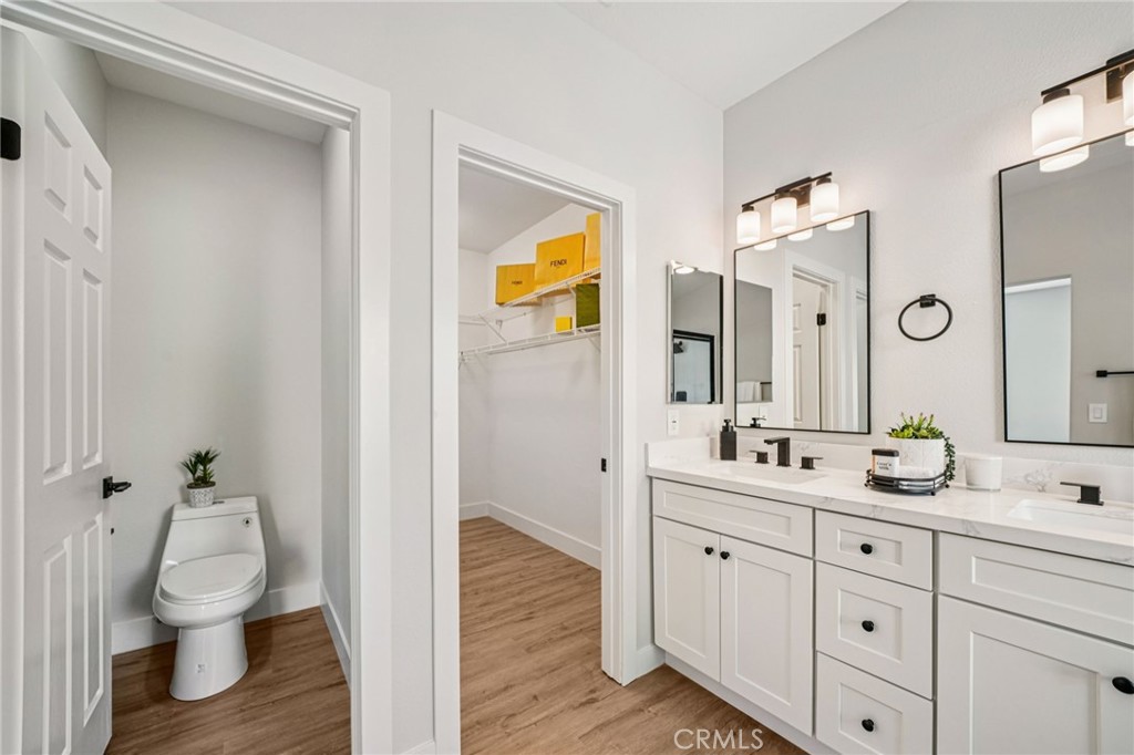 12842 Tilden Drive Rancho Cucamonga, CA 91739 - Photo 32 of 71 a spacious bathroom with a toilet sink and mirror