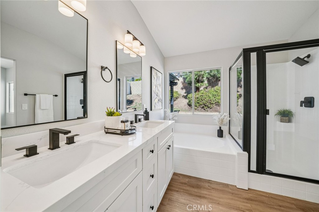 12842 Tilden Drive Rancho Cucamonga, CA 91739 - Photo 34 of 71 a bathroom with a tub sink and mirror