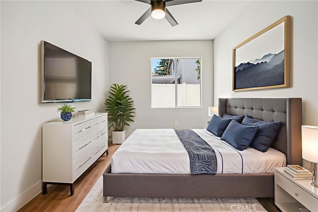 12842 Tilden Drive Rancho Cucamonga, CA 91739 - Photo 38 of 71 a bedroom with a large bed and a flat screen tv