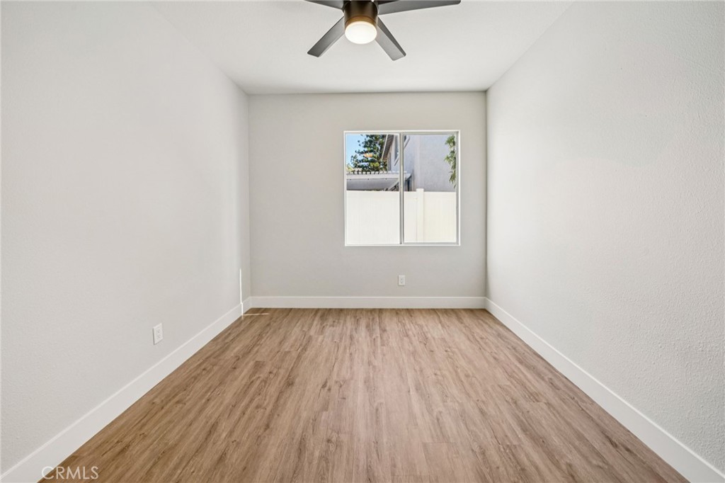 12842 Tilden Drive Rancho Cucamonga, CA 91739 - Photo 39 of 71 an empty room with a window and wooden floor