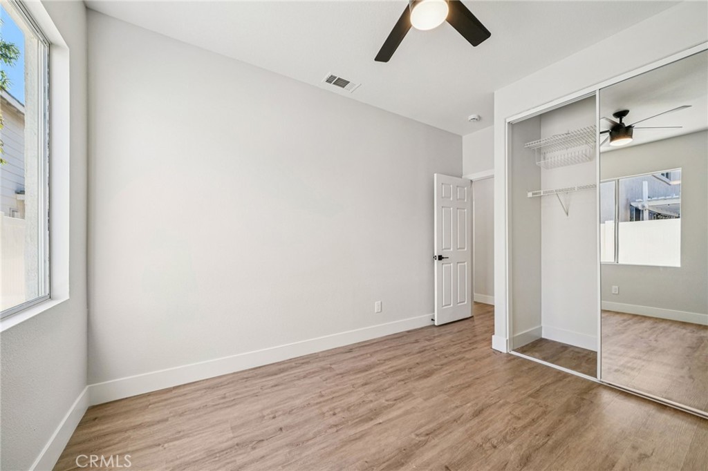 12842 Tilden Drive Rancho Cucamonga, CA 91739 - Photo 41 of 71 wooden floor in an empty room with a window