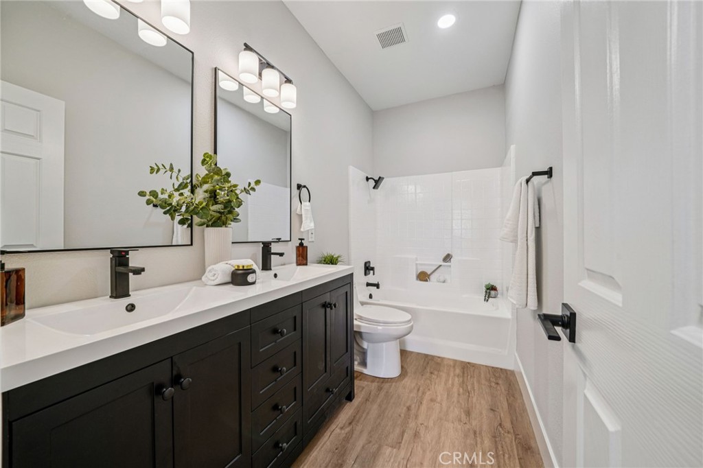 12842 Tilden Drive Rancho Cucamonga, CA 91739 - Photo 43 of 71 a bathroom with a double vanity sink toilet and shower