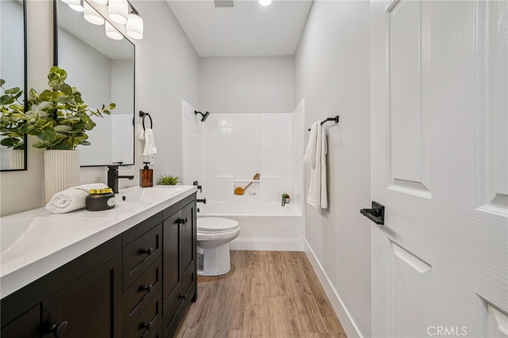 12842 Tilden Drive Rancho Cucamonga, CA 91739 - Photo 44 of 71 a bathroom with a sink a toilet and shower