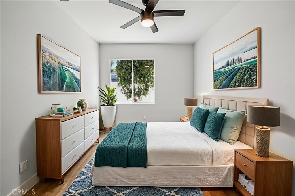 12842 Tilden Drive Rancho Cucamonga, CA 91739 - Photo 45 of 71 a bedroom with a bed and a chandelier