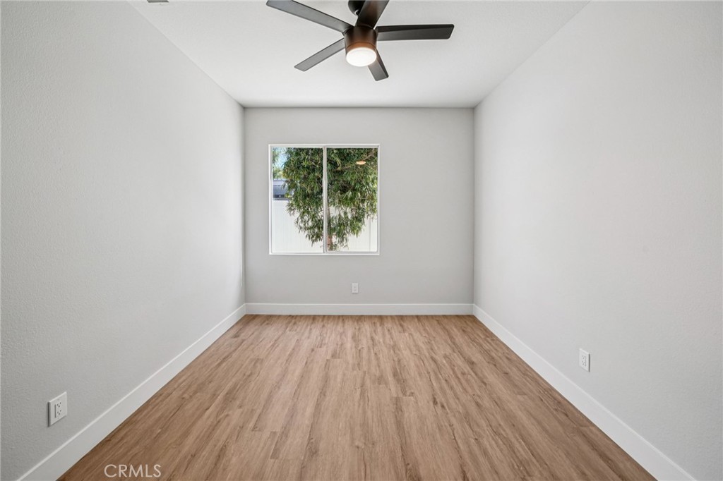 12842 Tilden Drive Rancho Cucamonga, CA 91739 - Photo 46 of 71 an empty room with a window and a ceiling fan