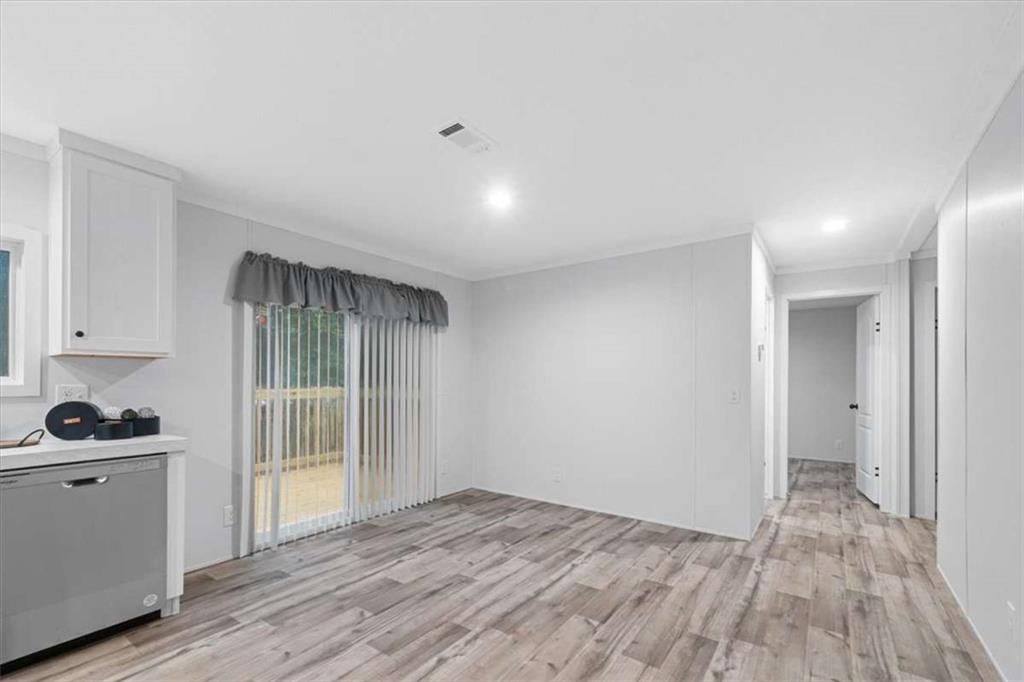 277 Napier Road Southwest Eatonton, GA 31024 - Photo 16 of 34 a view of empty room with wooden floor and fan
