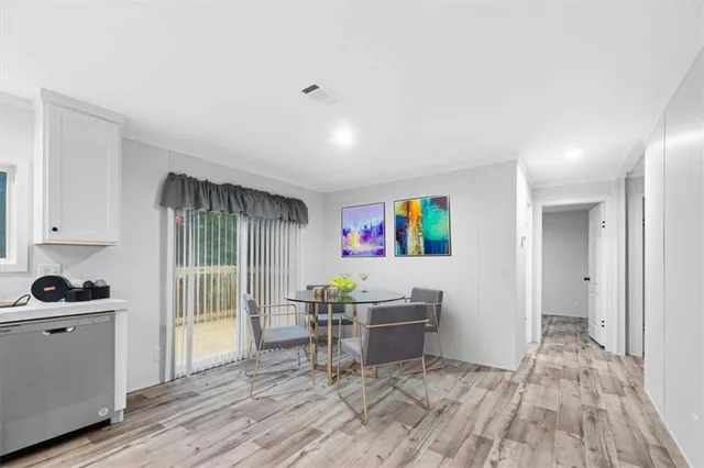 a view of kitchen and wooden floor
