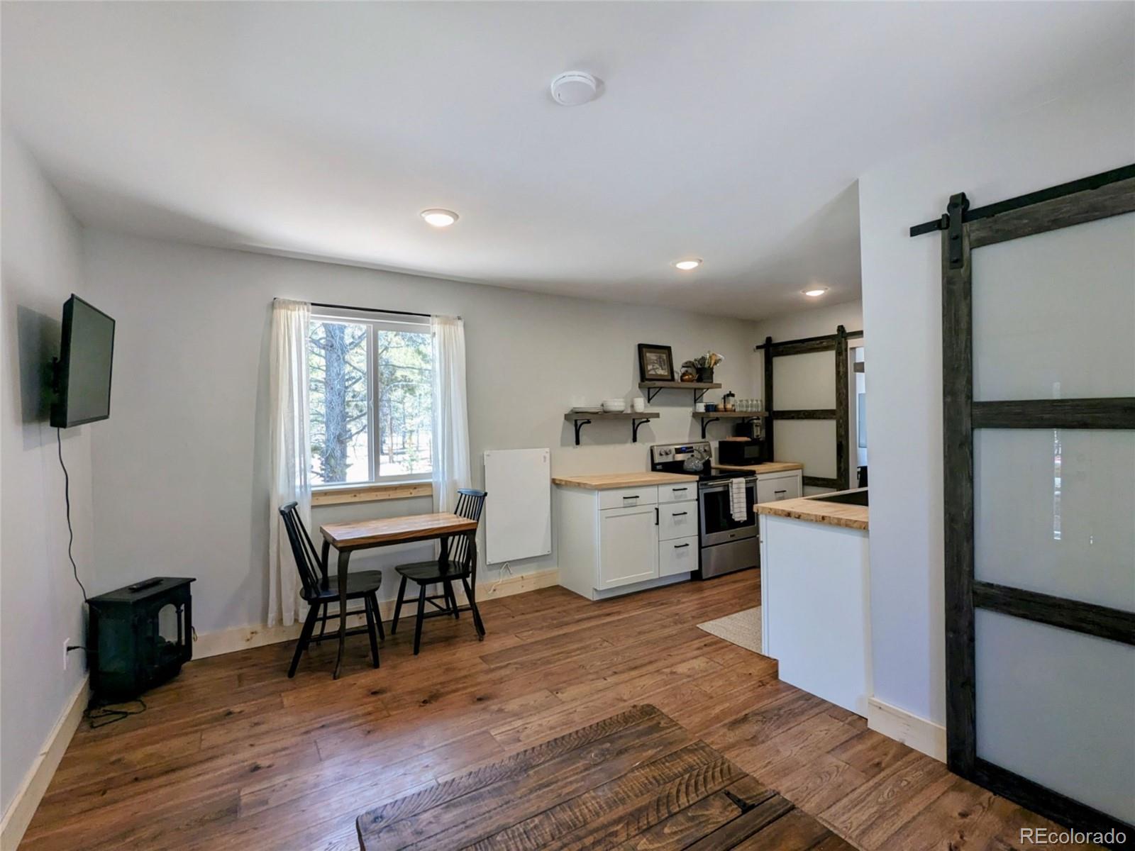 200 County Road 4C-E Leadville, CO 80461 - Photo 18 of 36 a kitchen with a dining table chairs and refrigerator