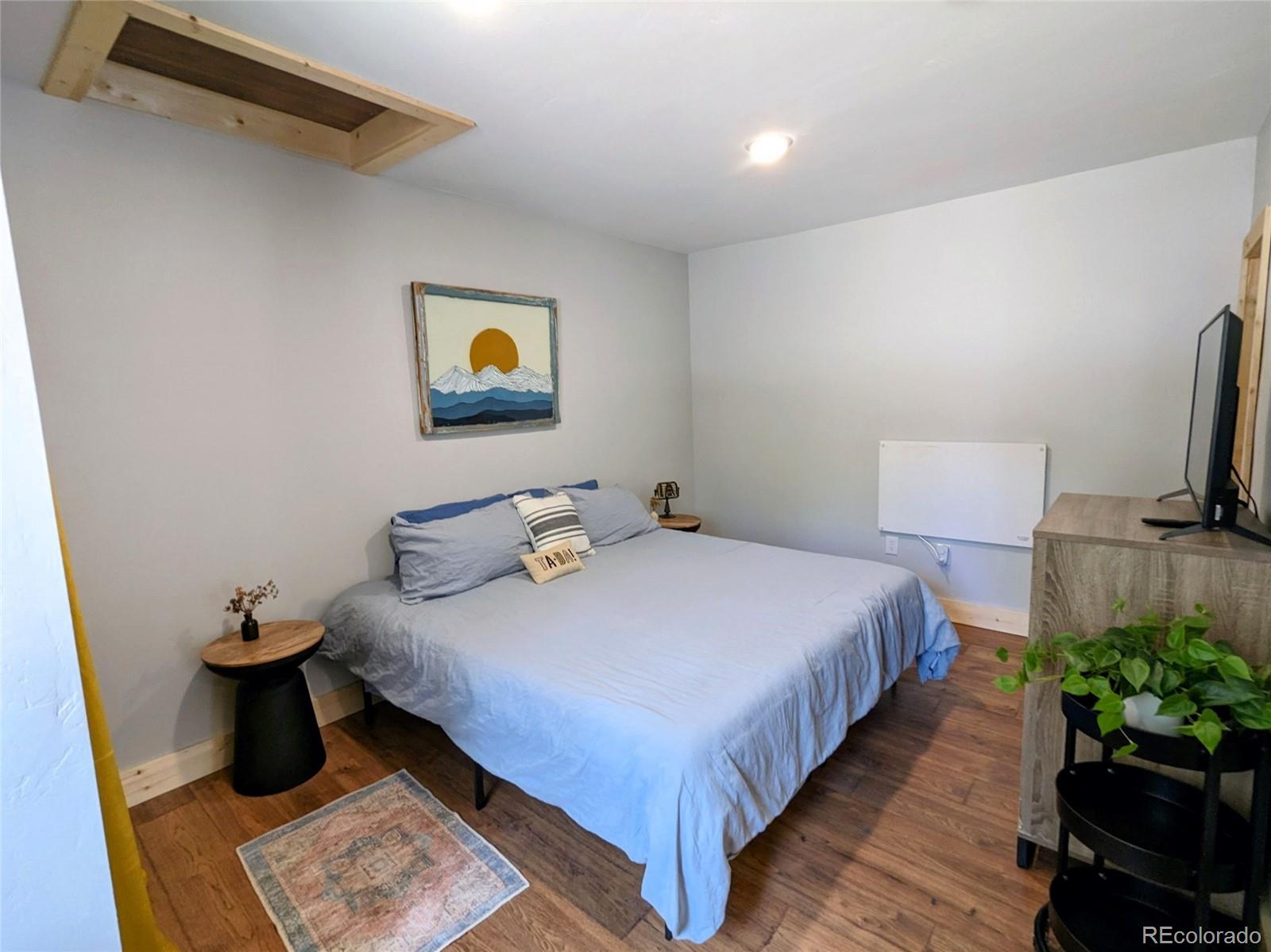 200 County Road 4C-E Leadville, CO 80461 - Photo 30 of 36 a bedroom with a bed and a flat screen tv