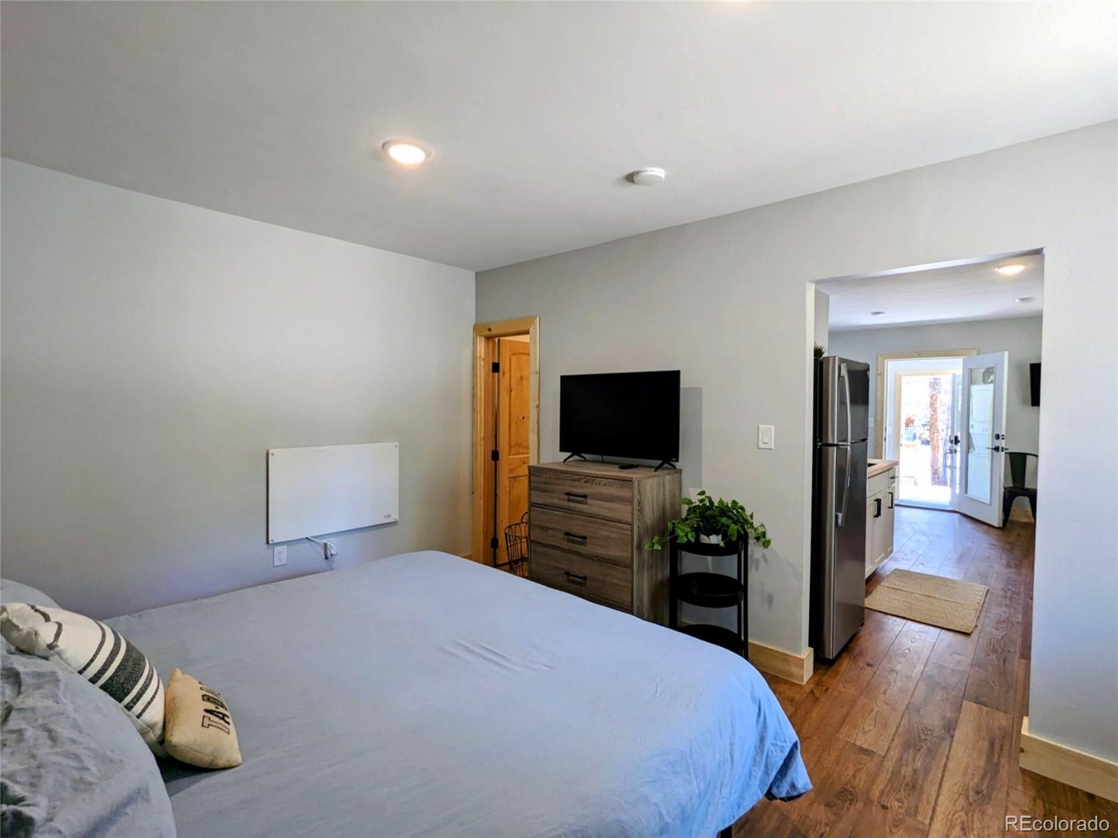 200 County Road 4C-E Leadville, CO 80461 - Photo 33 of 36 a bedroom with a bed and a flat screen tv