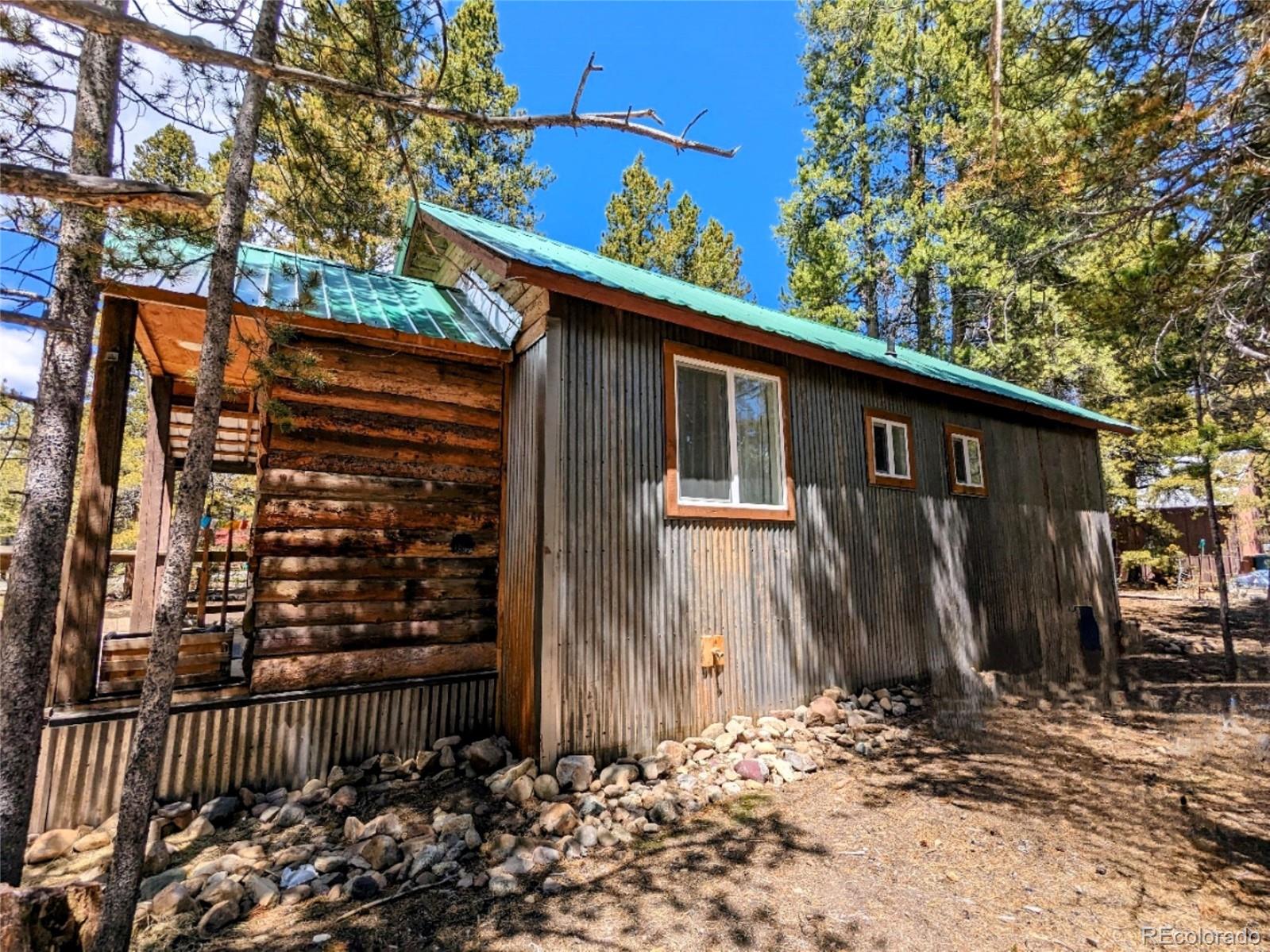 200 County Road 4C-E Leadville, CO 80461 - Photo 6 of 36 a view of a house with backyard and chair