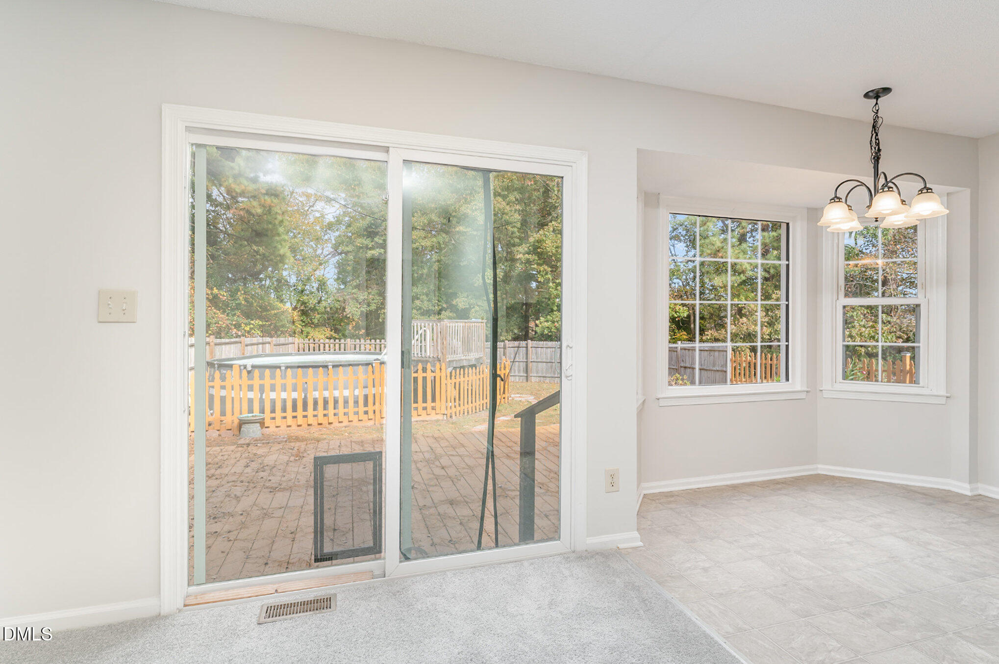 110 Rose Circle Dunn, NC 28334 - Photo 12 of 37 a view of an empty room with windows