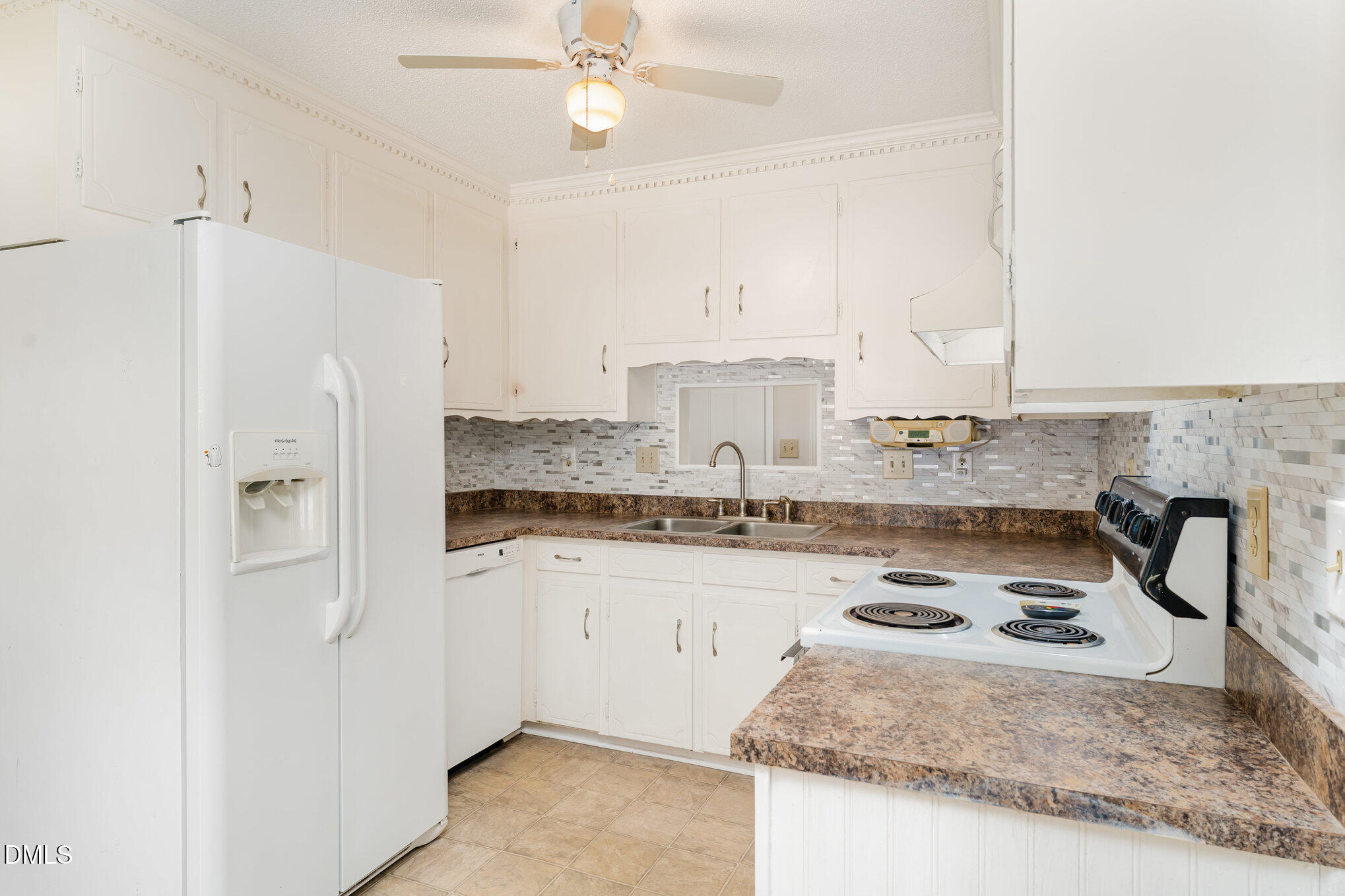 110 Rose Circle Dunn, NC 28334 - Photo 14 of 37 a kitchen with stainless steel appliances granite countertop a sink a stove and a refrigerator