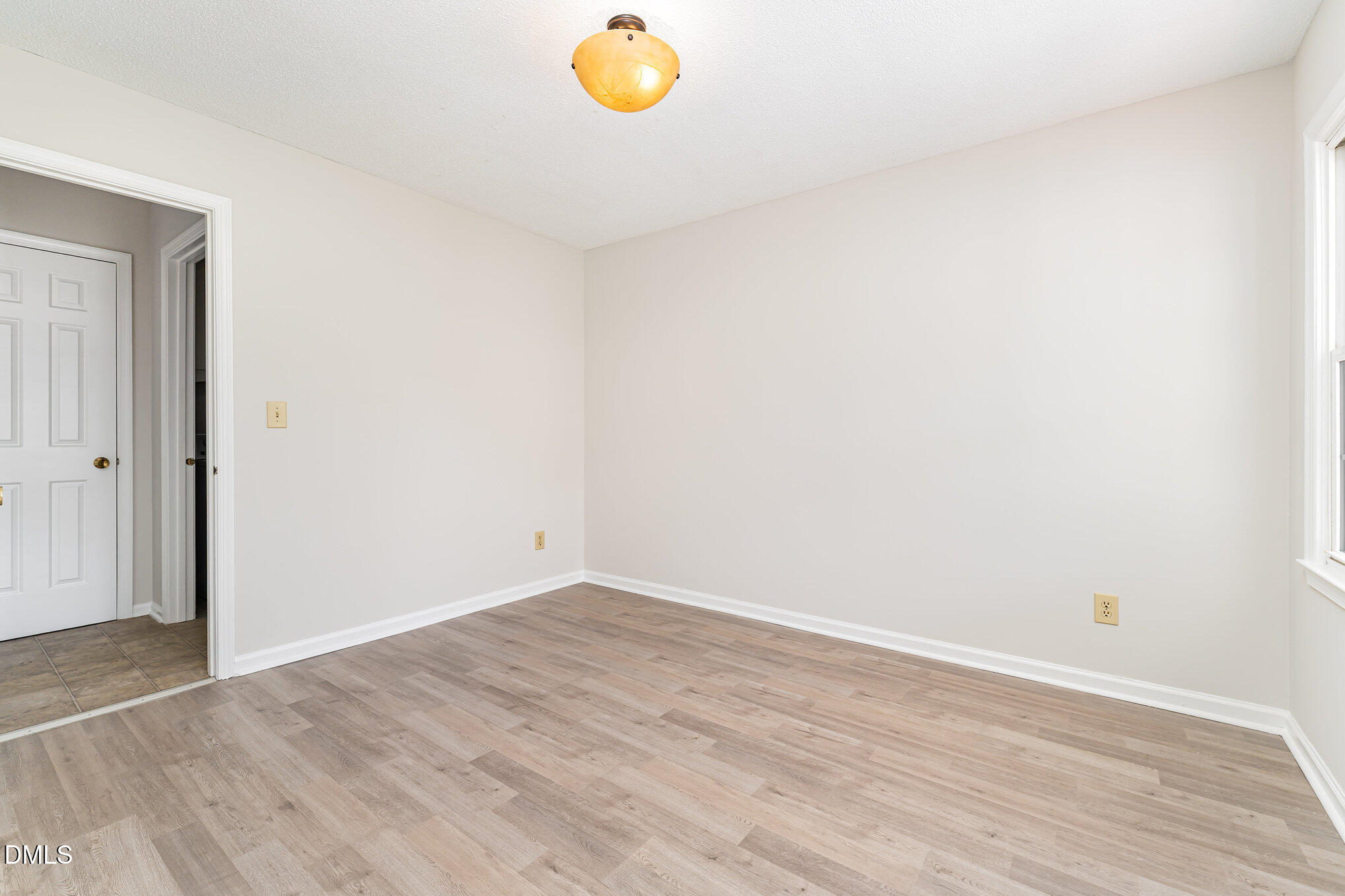 110 Rose Circle Dunn, NC 28334 - Photo 17 of 37 an empty room with wooden floor