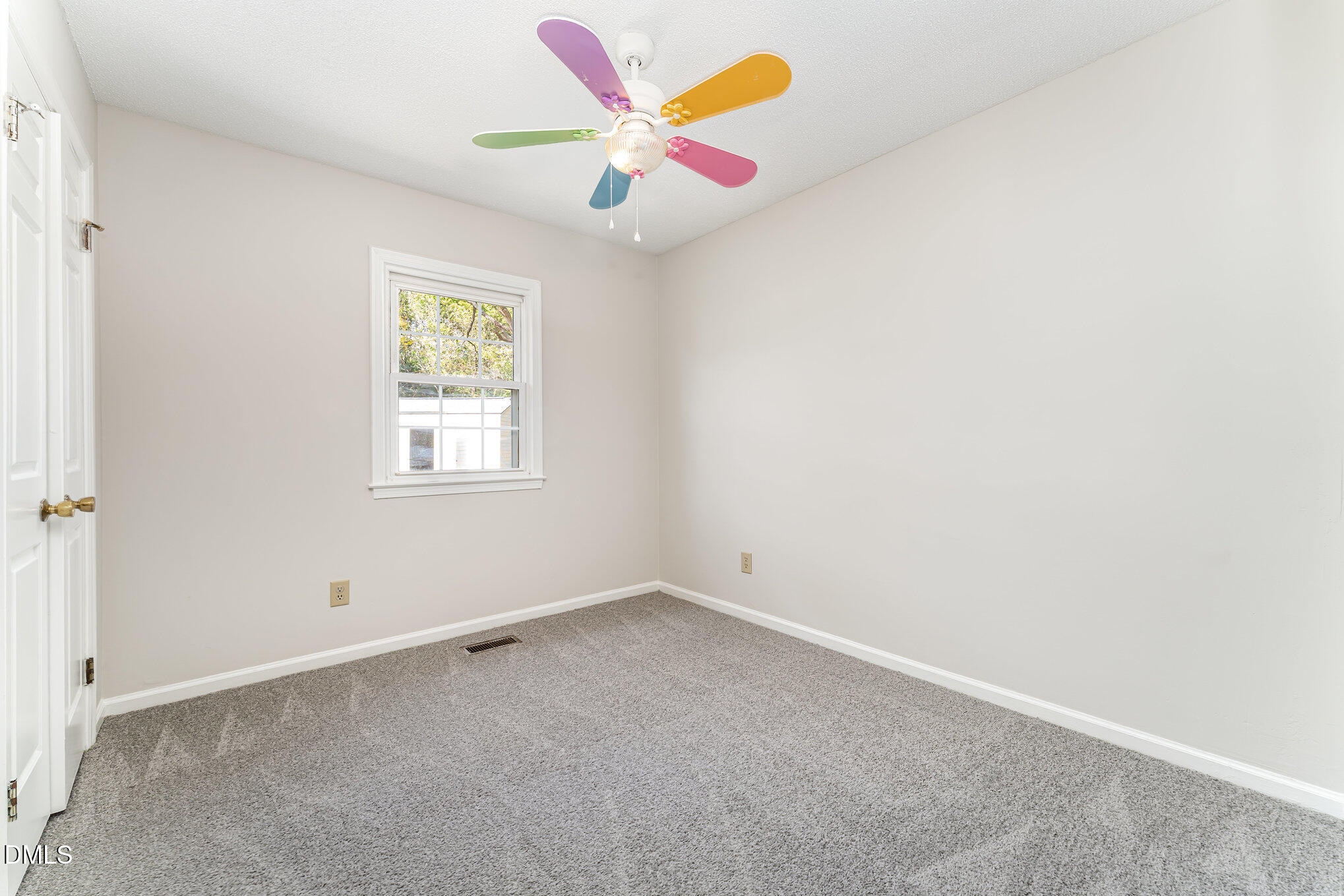 110 Rose Circle Dunn, NC 28334 - Photo 19 of 37 an empty room with a window and a fan