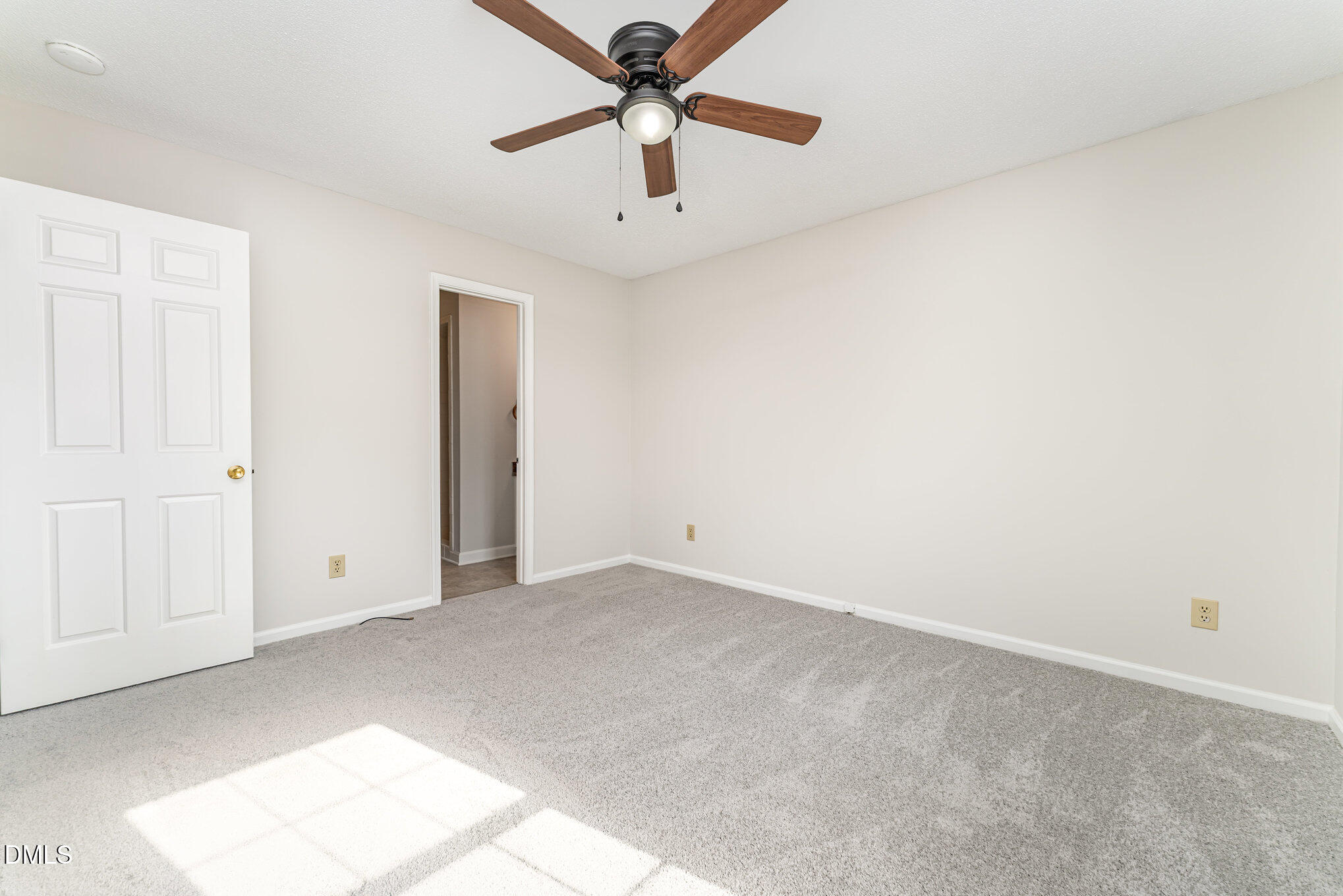 110 Rose Circle Dunn, NC 28334 - Photo 26 of 37 an empty room with chandelier fan
