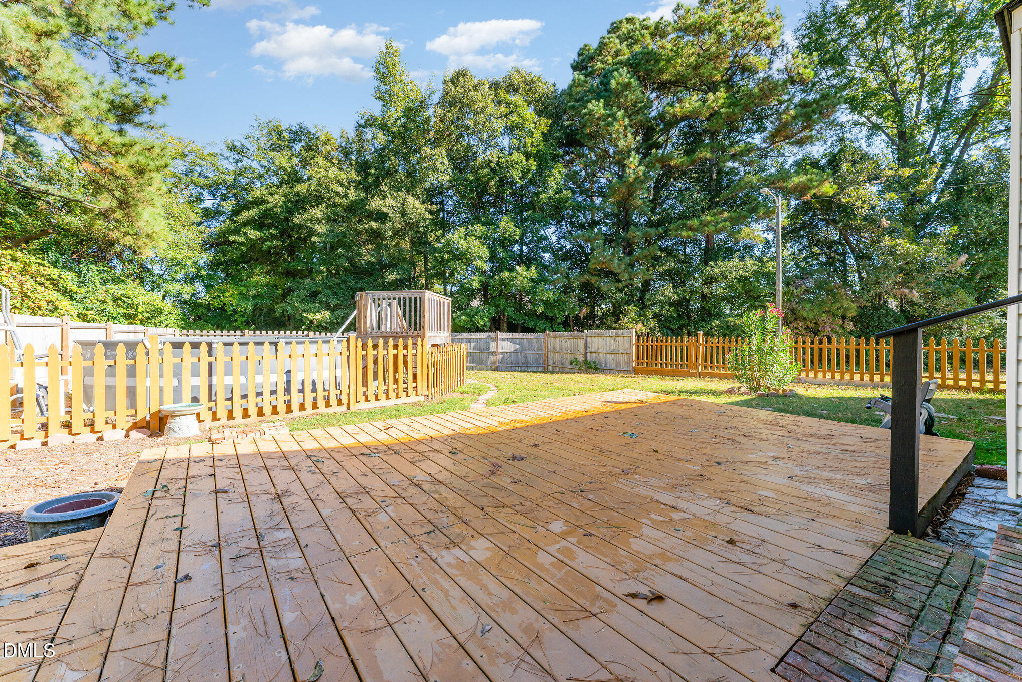 110 Rose Circle Dunn, NC 28334 - Photo 31 of 37 a view of a swimming pool with wooden floor and fence next to a yard