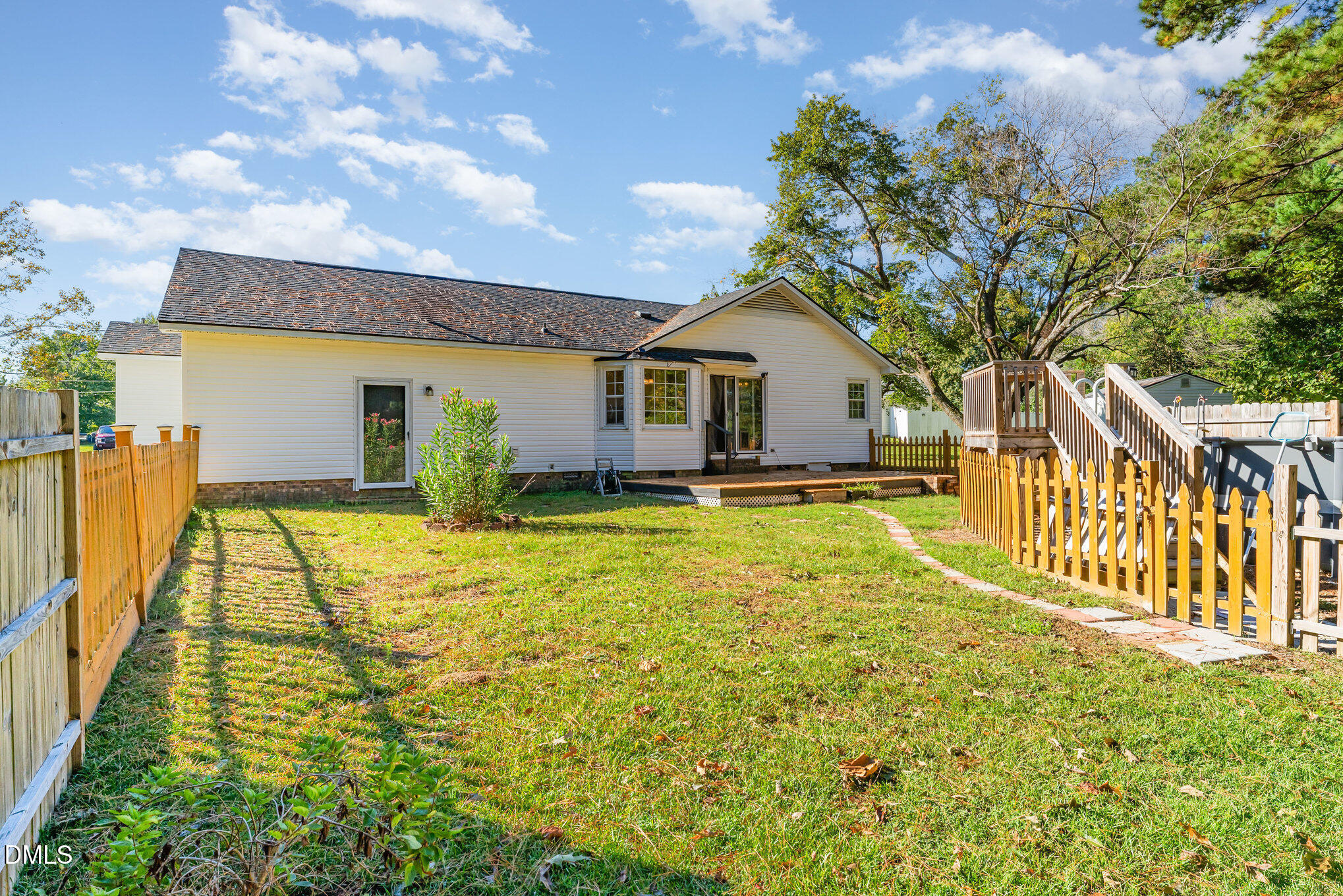 110 Rose Circle Dunn, NC 28334 - Photo 35 of 37 a view of a house with pool and wooden fence